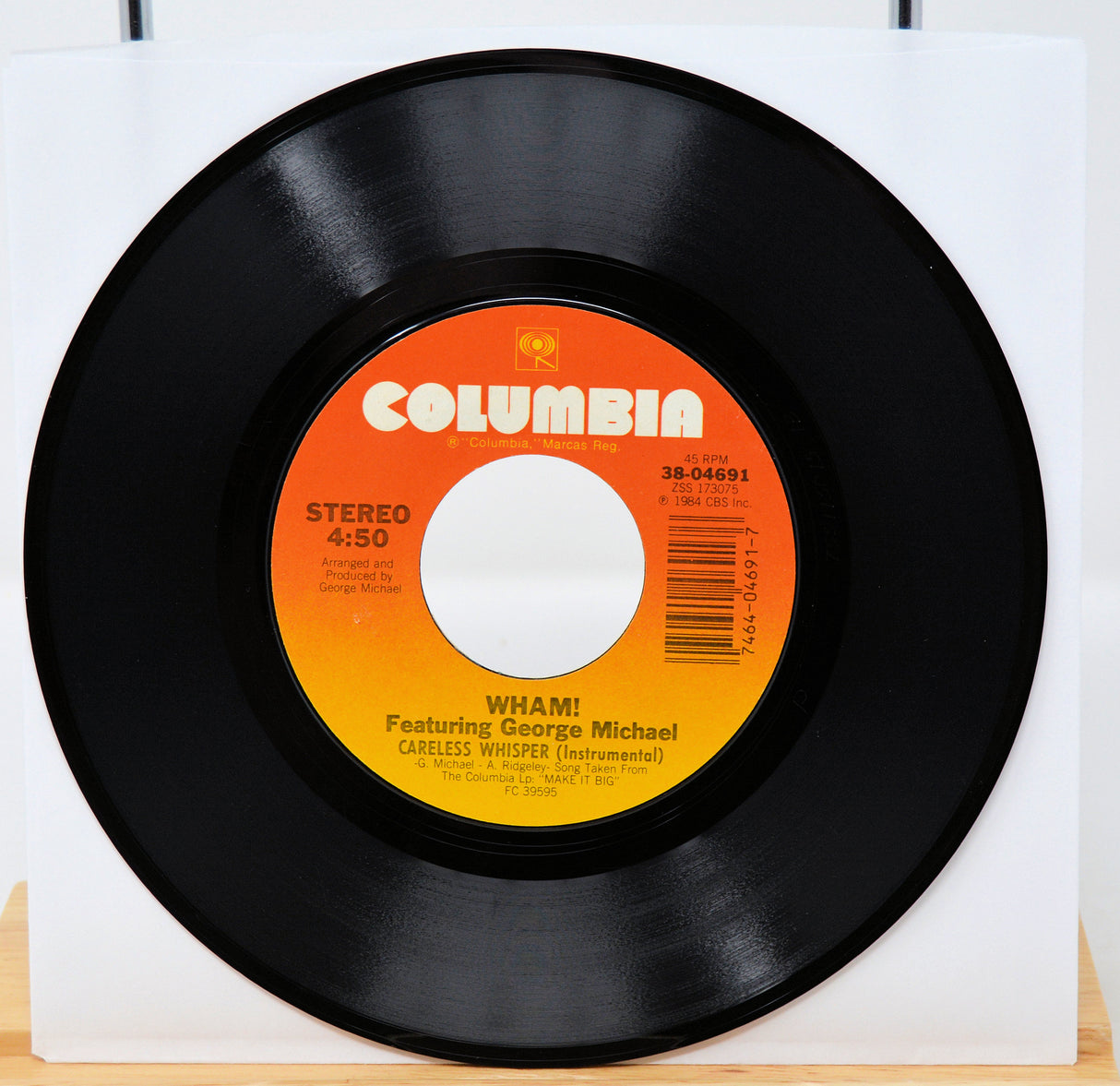 Vinyl record with Columbia label featuring George Michael on a white background