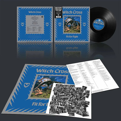Vinyl record set with blue cover, black record, and photo insert on a reflective surface.