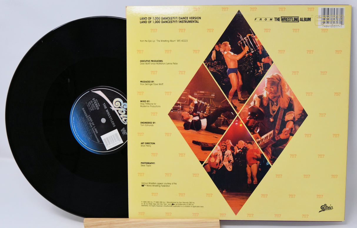 Vinyl record with its cover displaying album artwork and text.