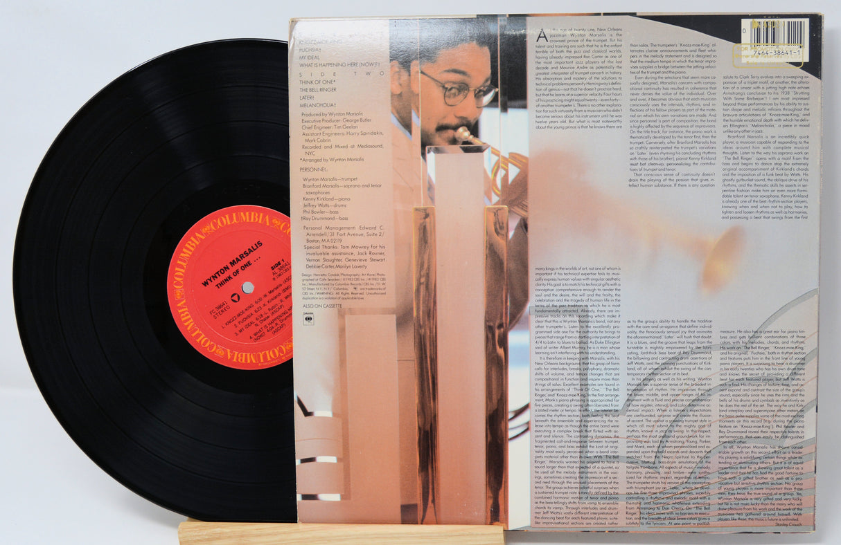 Vinyl record with a person on the cover and text on the back