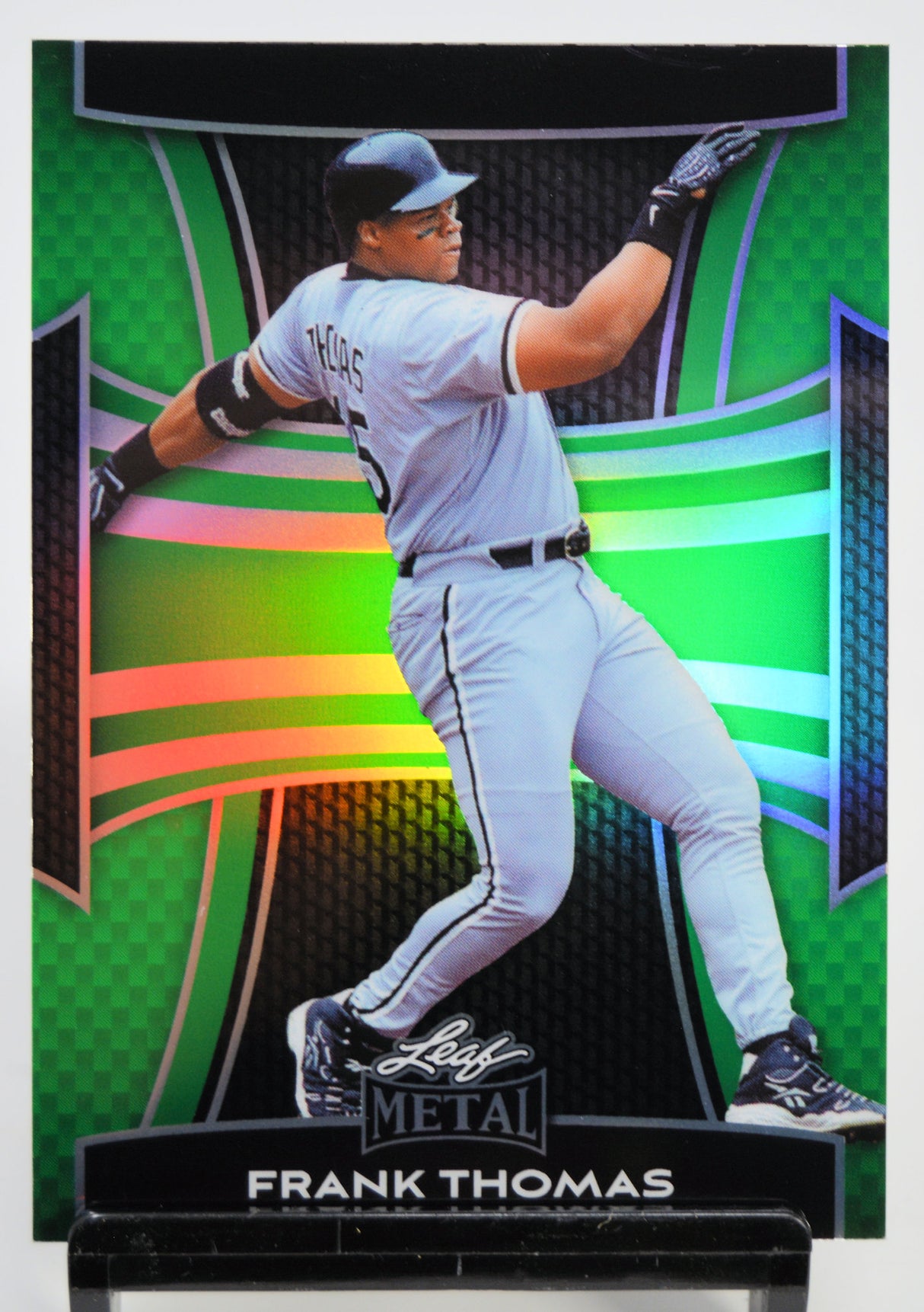 Baseball trading card of Frank Thomas in a dynamic pose with colorful background