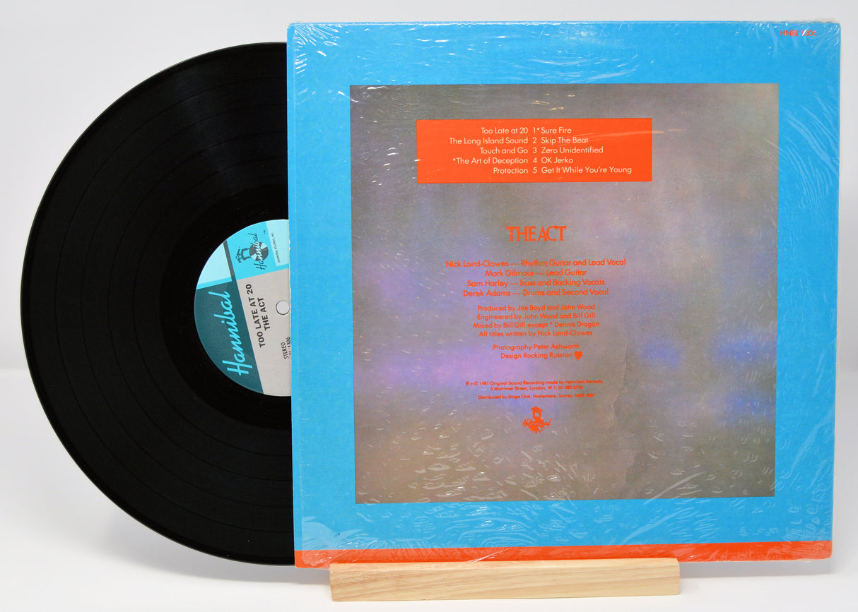 Vinyl record of The Act album 'Too Late At 20' with a blue and orange cover.