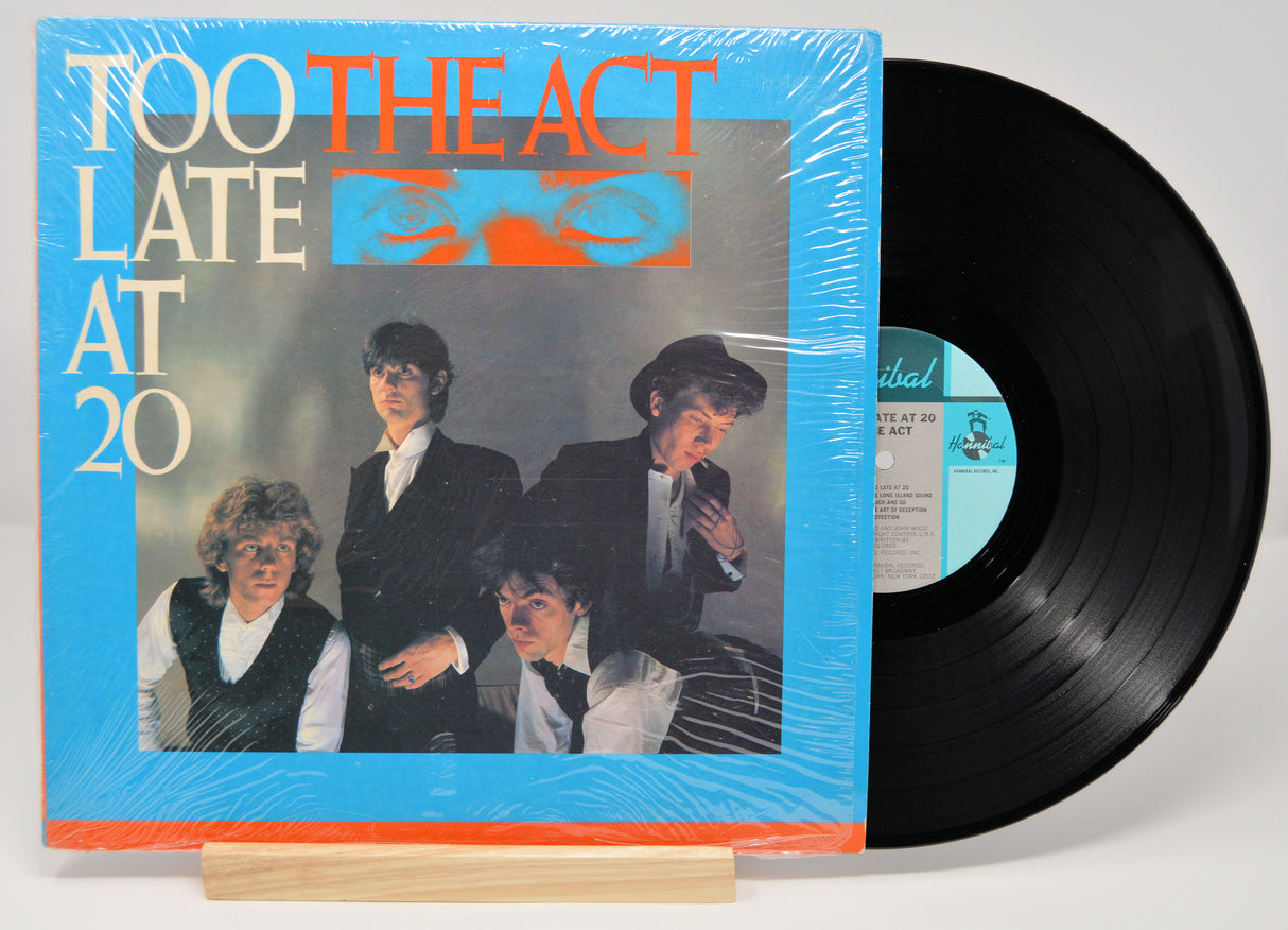Vinyl record of The Act album 'Too Late At 20' with a blue and orange cover.