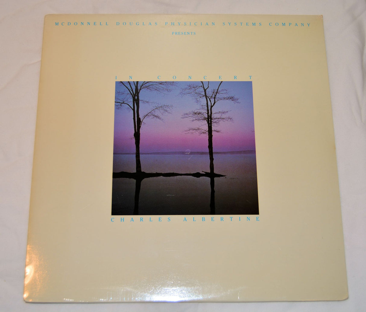 New vinyl record of Albertine, Charles - In Concert with a landscape photo of a tree standing in front of a pink sky at dusk on the cover.