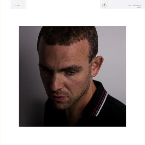 A black and white photograph of a person with a serious expression, intended to be a cover image for the Amen Dunes album 'Freedom'.