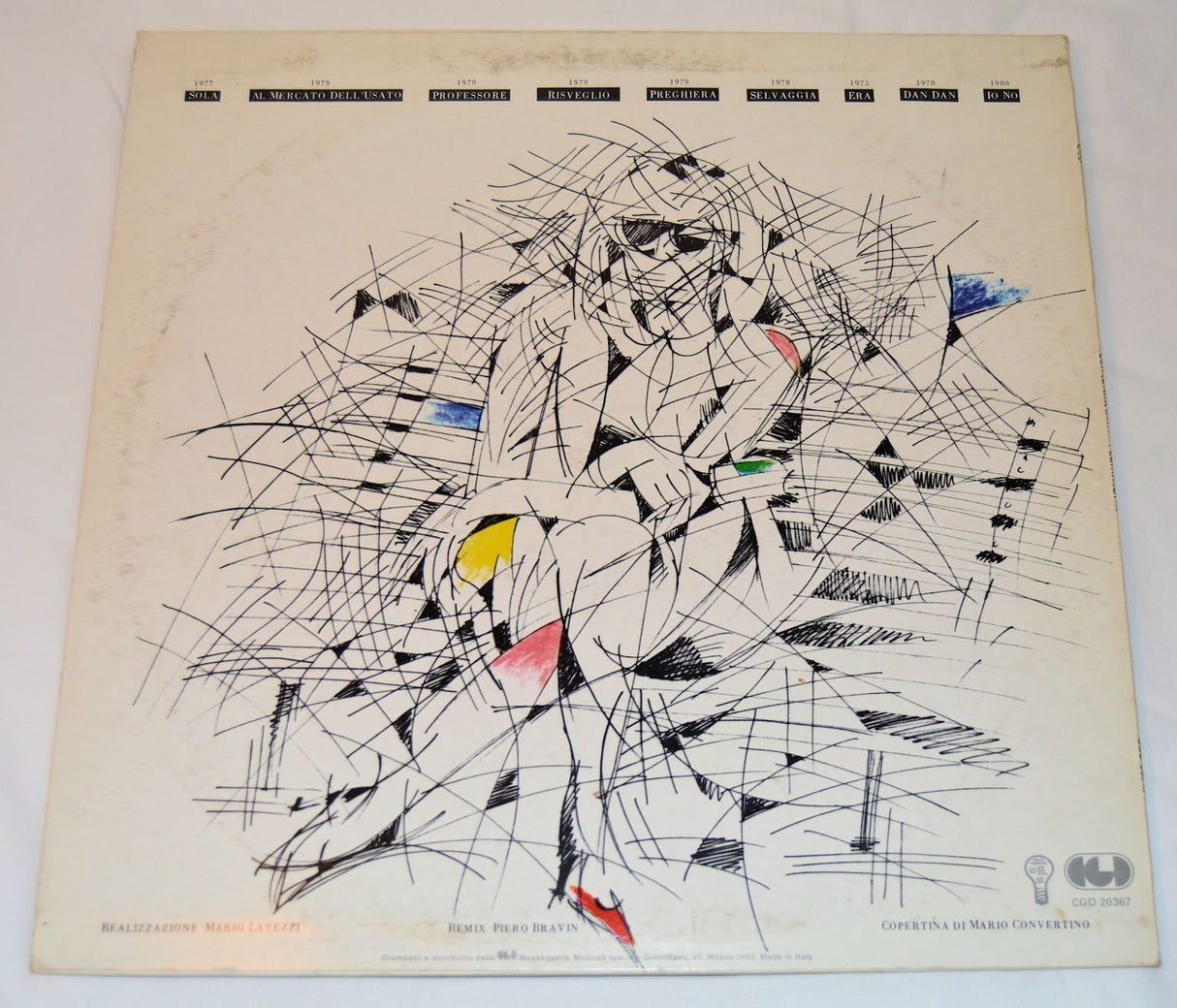 Vinyl record cover with a person sitting on a bench holding a green object, with 'Loredana Berté' text at the top.