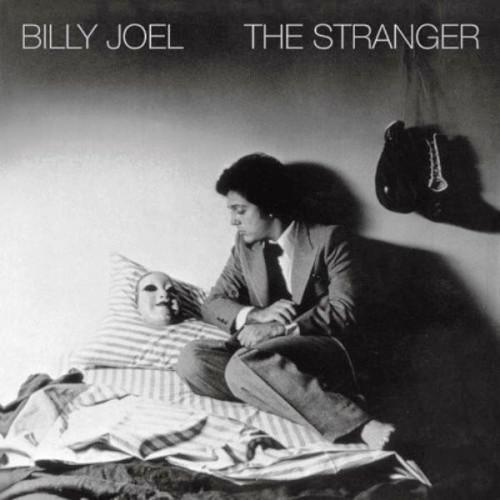 Album cover for Billy Joel's The Stranger featuring a black and white photograph of Billy Joel and a woman lying in bed.