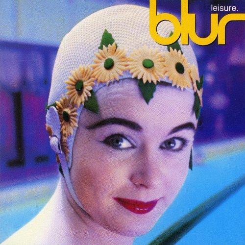 A vinyl record cover featuring a stylized photograph of a person with a sunflower on their head, wearing a swim cap, with the band name 'Blur' and the album title 'Leisure' printed at the top and bottom respectively.
