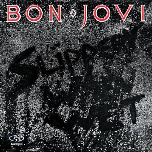 Album cover for 'Slippery When Wet' by Bon Jovi showing a wet window with the title written in the rain drops.