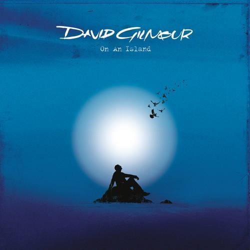 Album cover art for David Gilmour's 'On An Island' featuring a silhouette of the artist sitting by a moonlit sea with butterflies around.