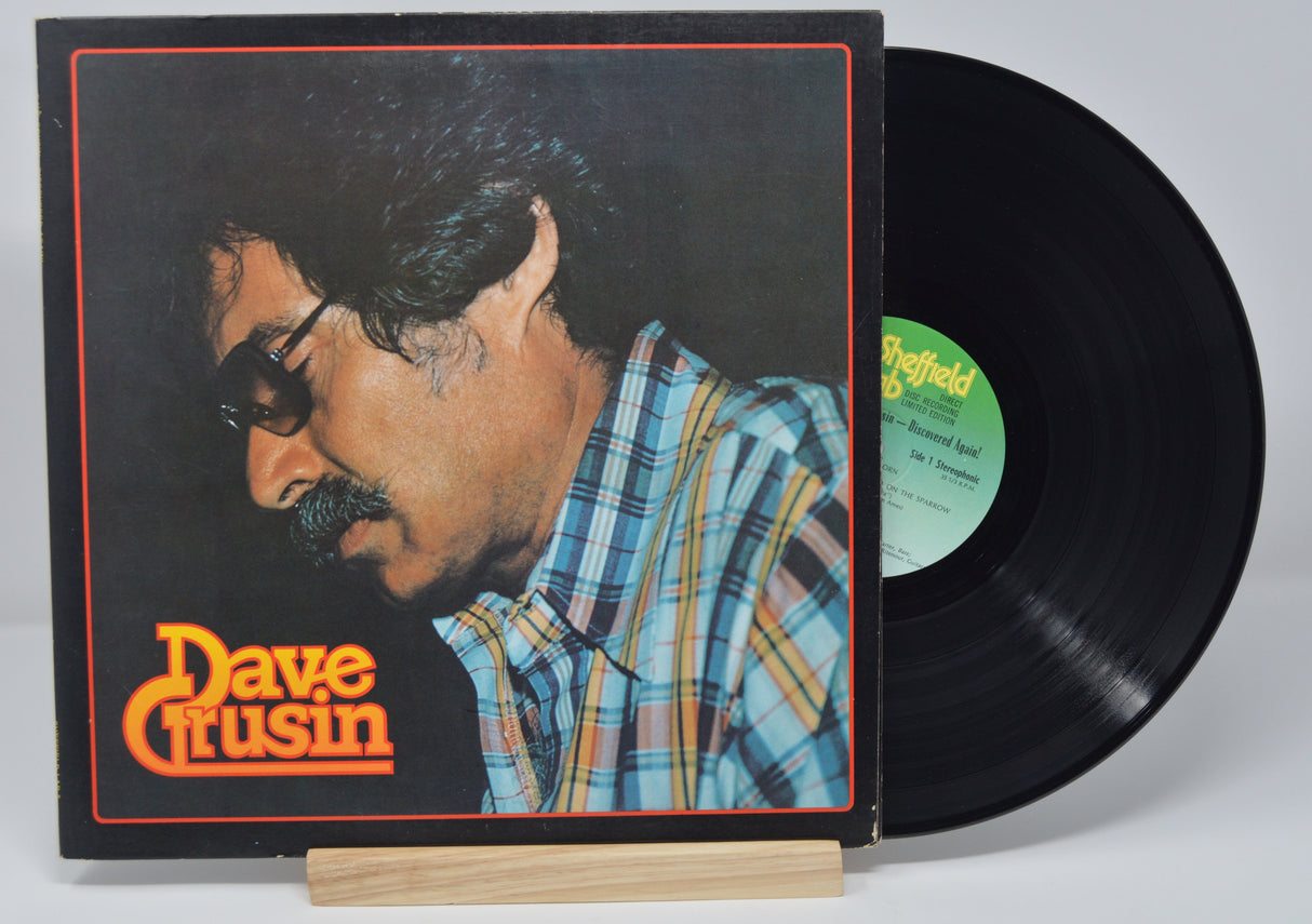 Vinyl record album by Dave Grusin titled Discovered Again showing a picture of him on the front cover.