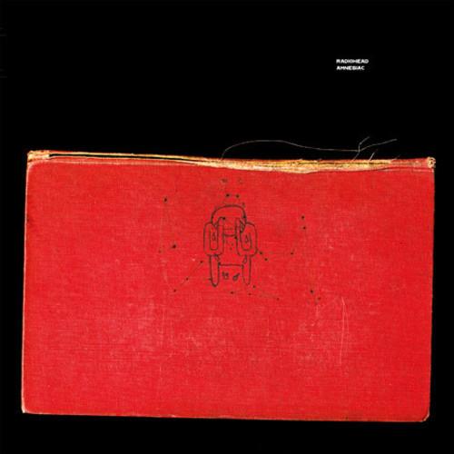 A red vinyl record of Radiohead - Amnesiac with the album cover showing the Radiohead logo and a unique graphic design.