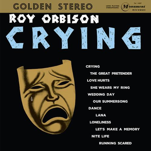 Album cover of 'Crying' by Roy Orbison with a mask and list of songs on a black background.