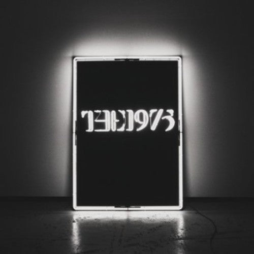 Vinyl Album cover with a neon sign with the text 'THE 1975' in capital letters, illuminated in a dark setting.