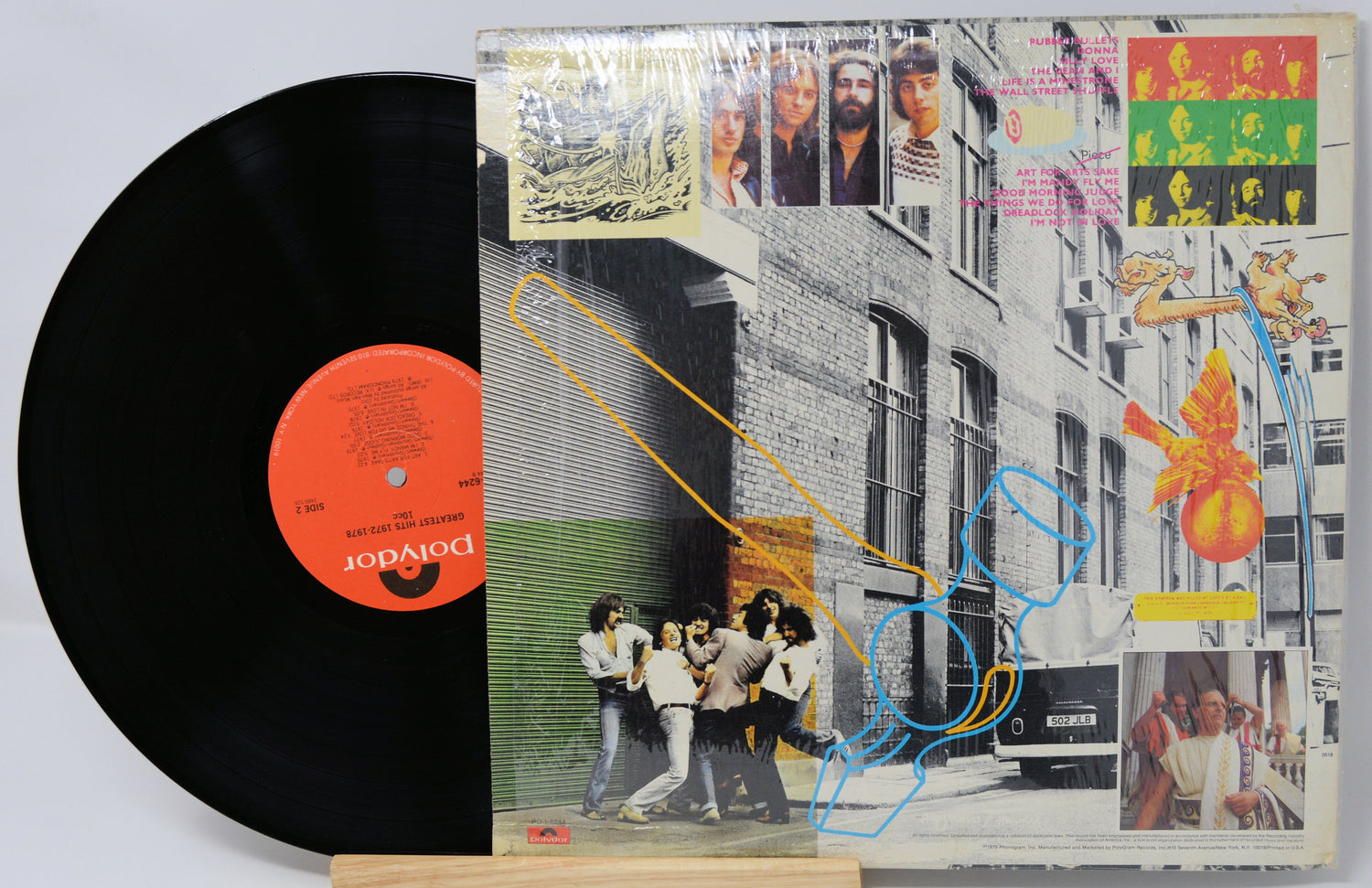 Vinyl record with a colorful cover featuring people and abstract designs.