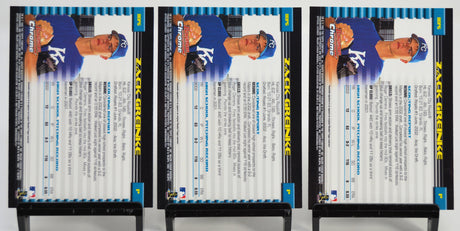 Back view of three 2002 Bowman Chrome Zack Greinke rookie cards displaying stats and biography