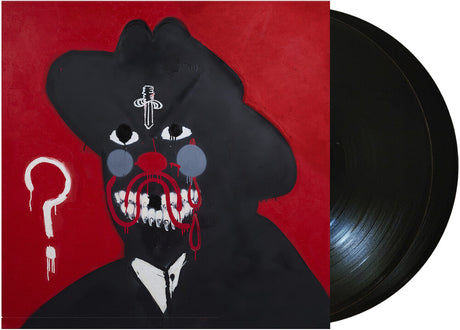 Vinyl record and a  front cover with a stylized face design on a red background