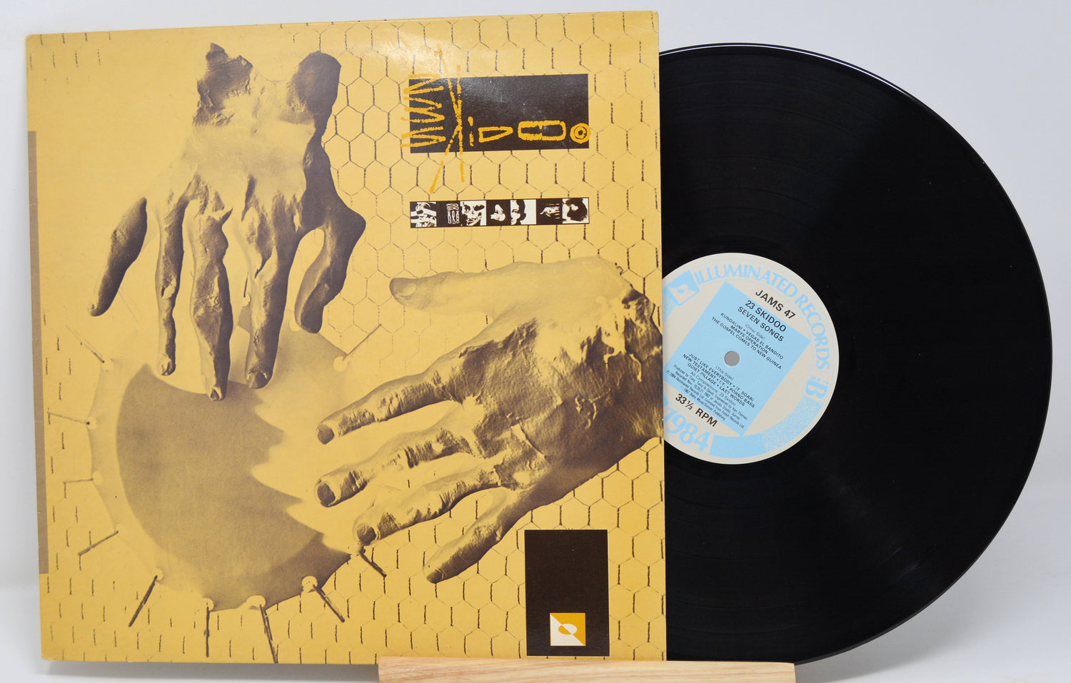Used vinyl record of 23 Skidoo with a yellow and black cover featuring a hand graphic design.