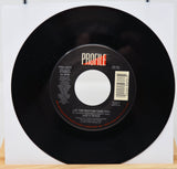 Black vinyl record with a label on a white background