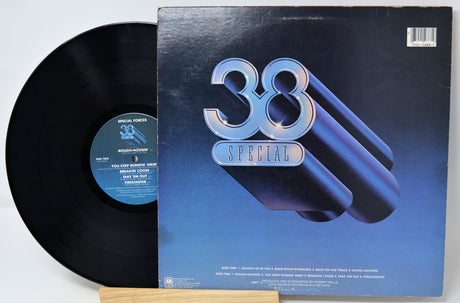 Vinyl record and cover with '38 Special' branding on a white background