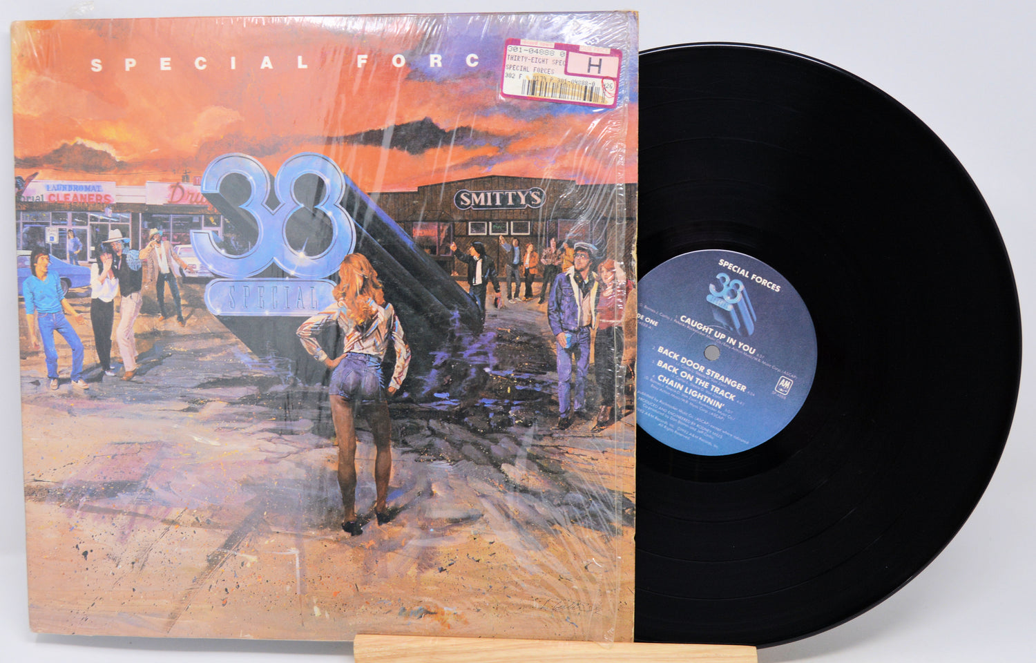 Vinyl record with cover featuring a person and text 'Special Force 38' on a white background