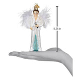 Hand holding a 5.25-inch glam rock singer ornament with white feathered wings