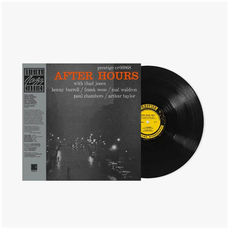 Vinyl record with 'After Hours' album cover featuring a city street at night.