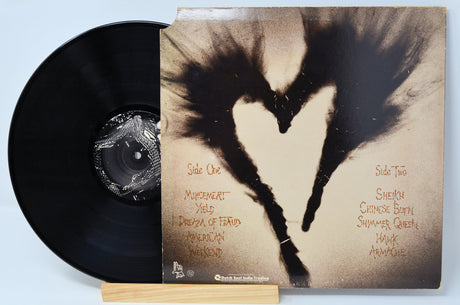 Used vinyl record of A.C. Temple - Blowtorch with record label visible.