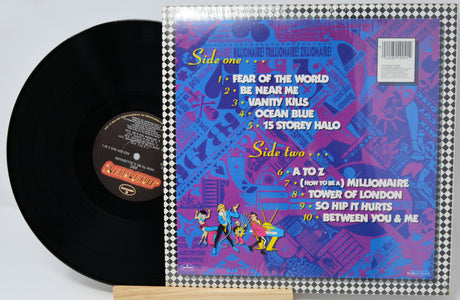 Vinyl record with colorful cover featuring track listings and artwork.