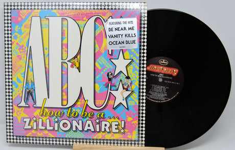 Vinyl record with colorful cover featuring text and graphics on a gray background