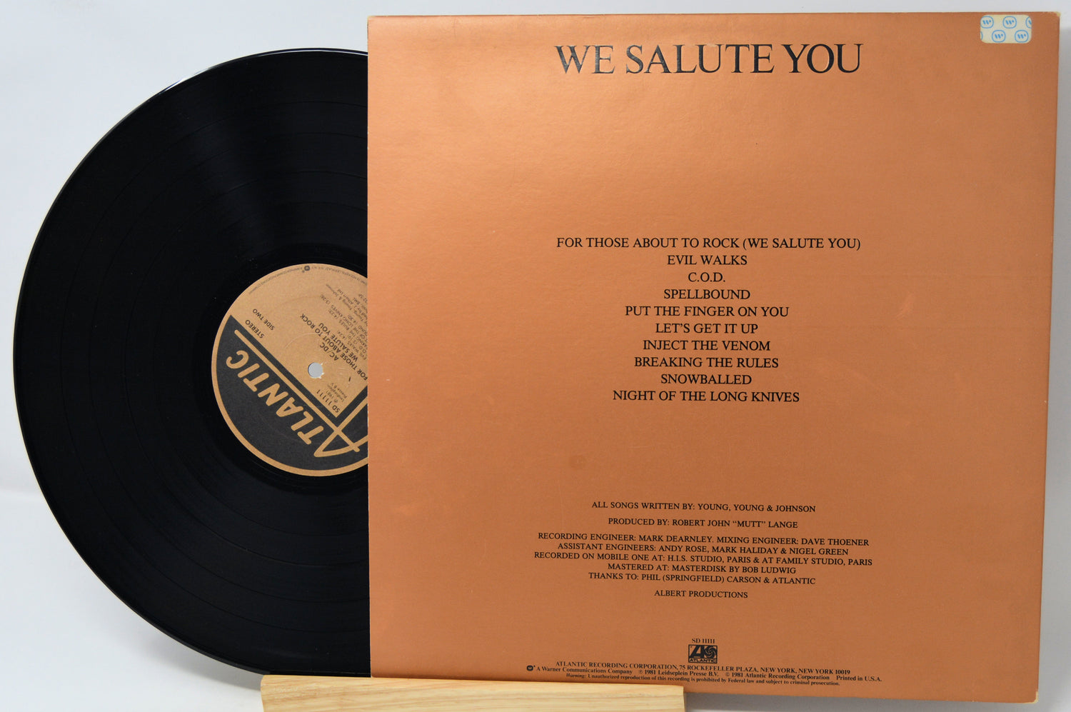 Vinyl record with brown cover displaying text and a logo.