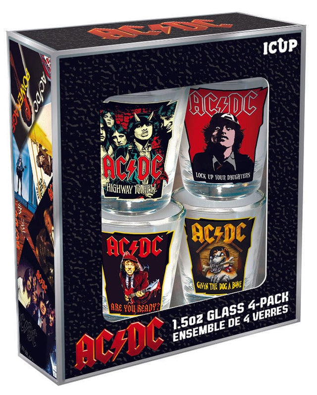 A set of four shot glasses with AC/DC band-themed designs, packaged in a black box with the band's logo and images of the band members.