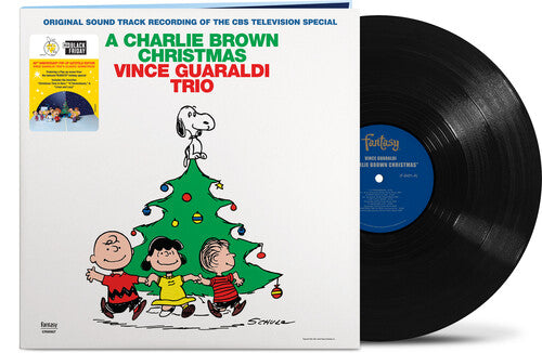 Front cover of A Charlie Brown Christmas vinyl soundtrack by Vince Guaraldi Trio featuring Peanuts characters and a decorated Christmas tree.