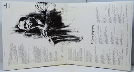Gatefold artwork of John Coltrane's 'A Love Supreme' vinyl, featuring iconic saxophone illustration and album liner notes