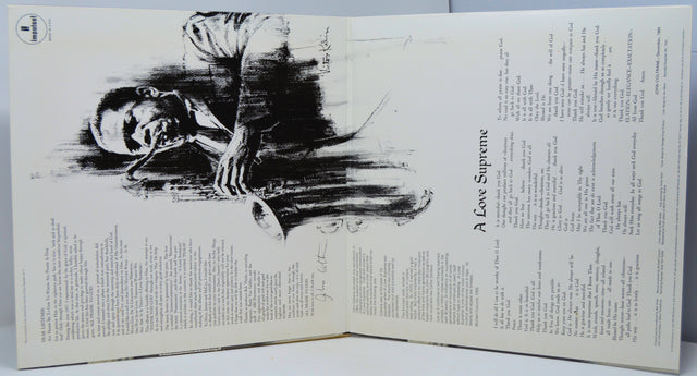 Gatefold artwork of John Coltrane's 'A Love Supreme' vinyl, featuring iconic saxophone illustration and album liner notes