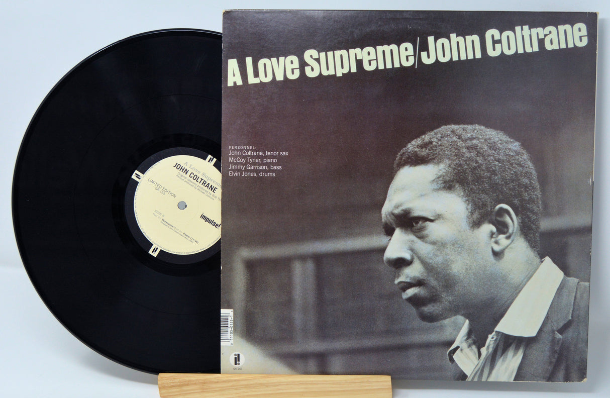 Back cover and record of John Coltrane's 'A Love Supreme' LP, detailing personnel and classic album design