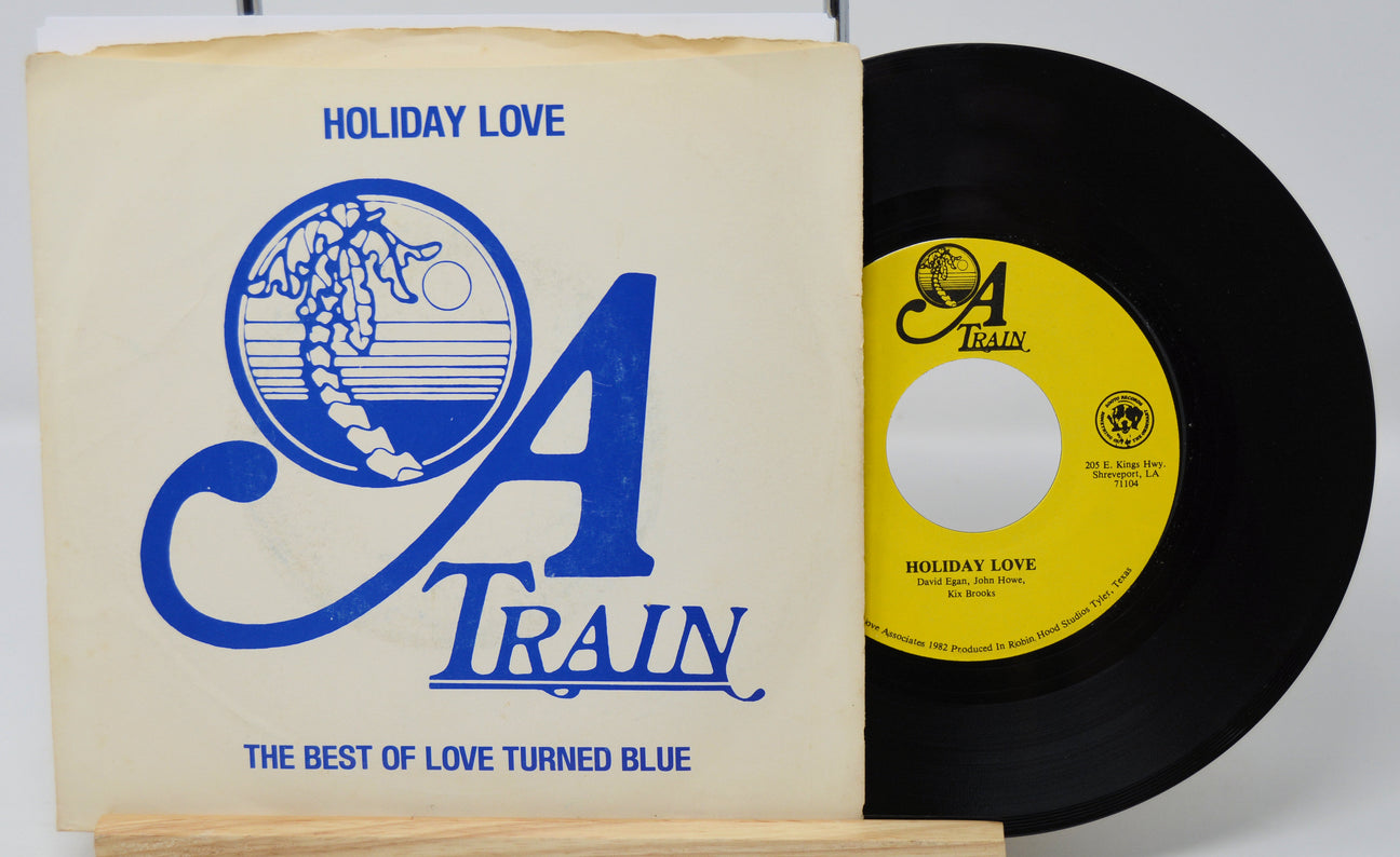 Vinyl record and cover with 'Holiday Love' by O.A. Train on a white background