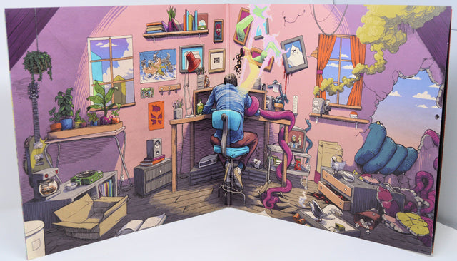 Colorful illustrated album gatefold depicting a chaotic artist's workspace with surreal tentacles and smoke