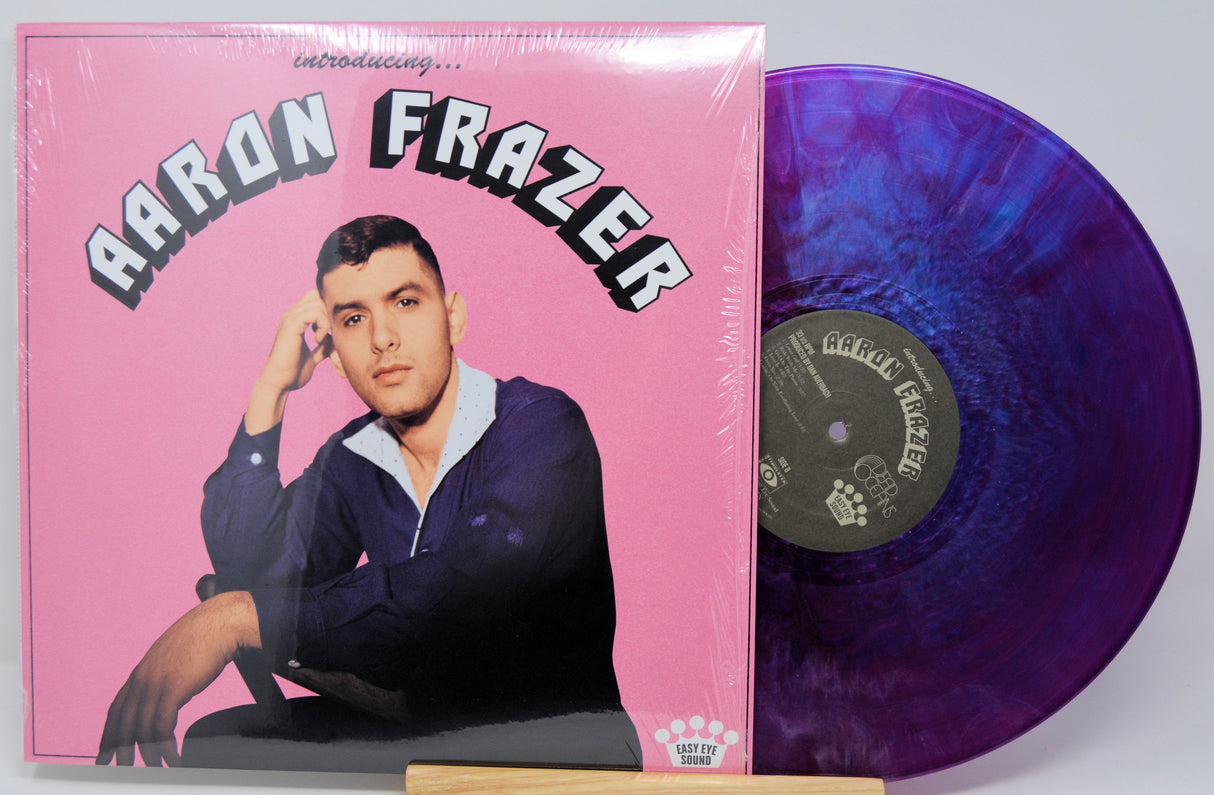 Front cover of Aaron Frazer Introducing... vinyl LP with purple swirl record and retro pink artwork