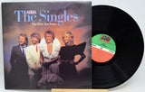 A vinyl record titled 'Abba - The Singles, First 10 Years' with a photo of the band members on the cover.