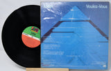 Vinyl record and its cover titled 'Voulez-Vous' by ABBA on a white background.