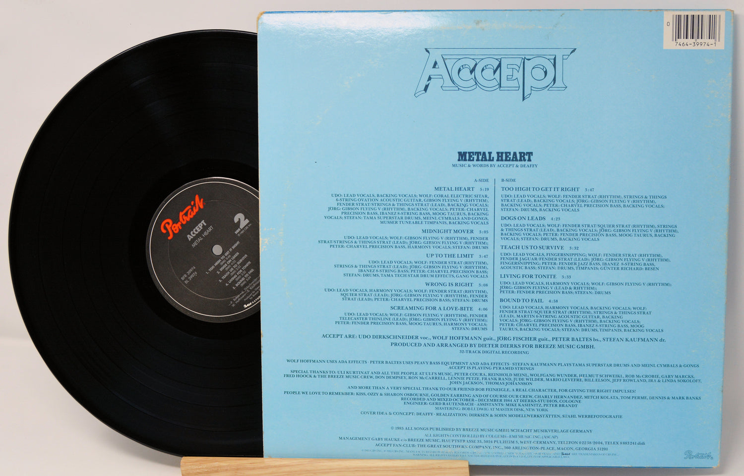 Vinyl record with blue cover featuring 'Accept' and text on a light gray background