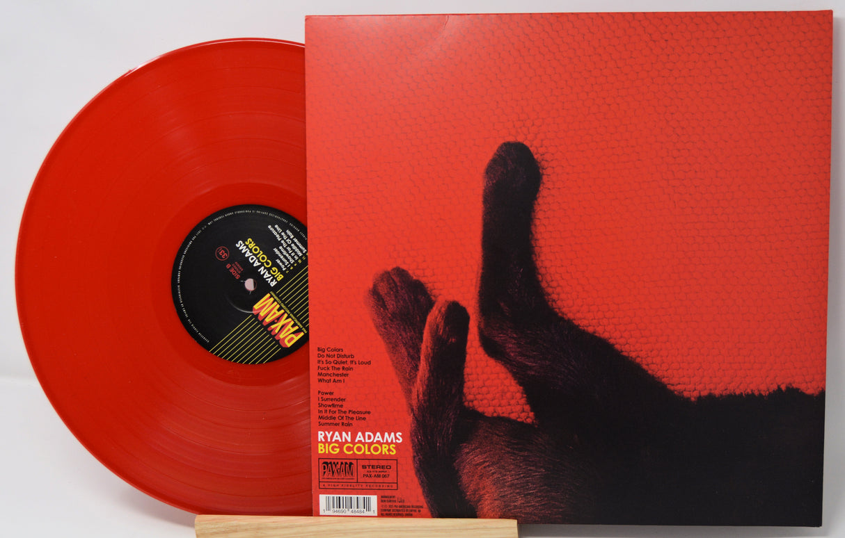 Red vinyl record with a black cat illustration on the cover