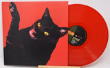 Red vinyl record with a black cat illustration on the cover
