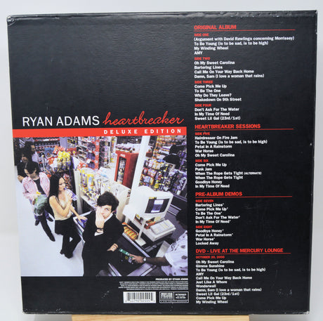 Back cover of Ryan Adams' 'Heartbreaker' deluxe edition album with album art and tracklist.