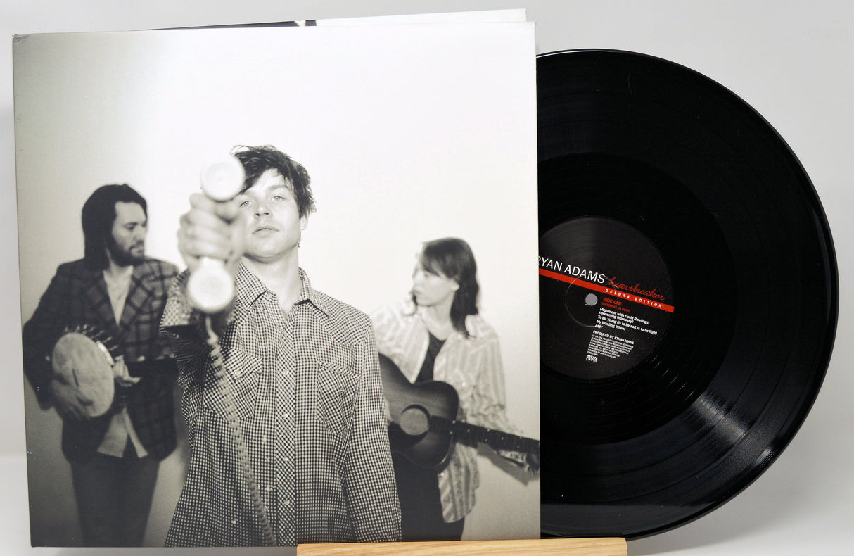 Vinyl record with a black and white photo cover featuring musicians.