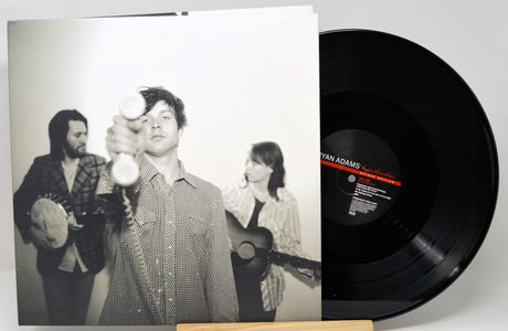 Vinyl record with a black and white photo cover featuring musicians.