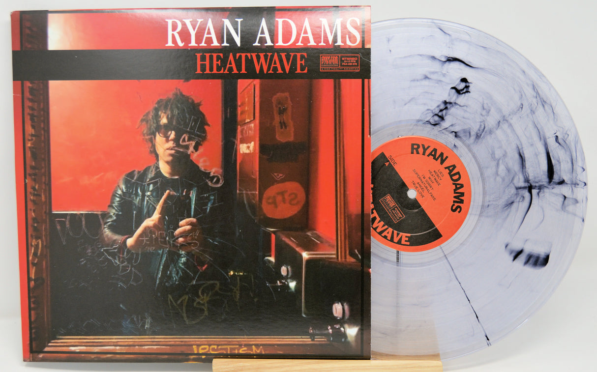 Vinyl record and cover for 'Heatwave' by Ryan Adams on a white background