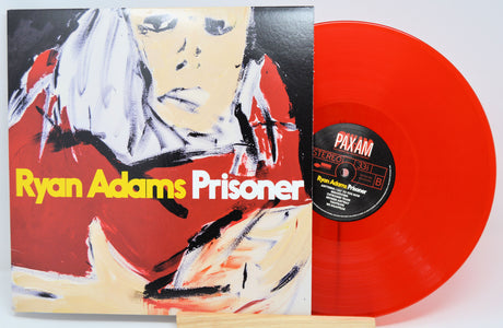 Red vinyl record with 'Ryan Adams Prisoner' album cover