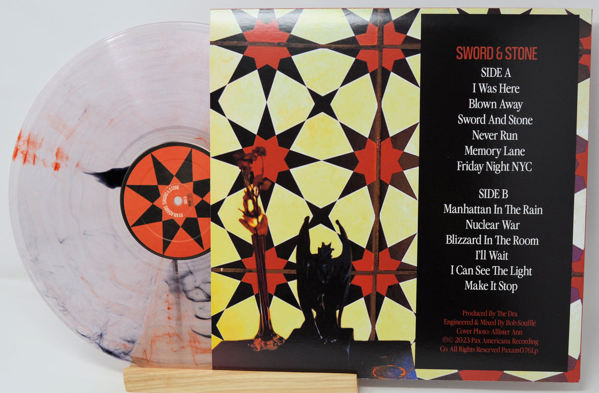 Vinyl record with colorful cover and white background